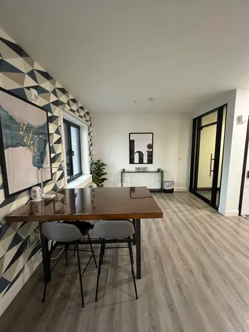 a workspace with furniture window and wooden floor