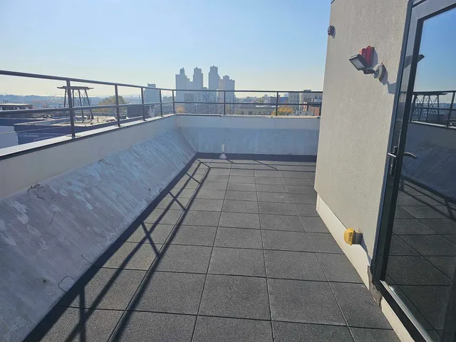 a kitchen with stainless steel appliances a refrigerator stove and cabinets