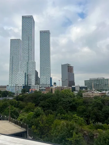 a view of a city with tall buildings