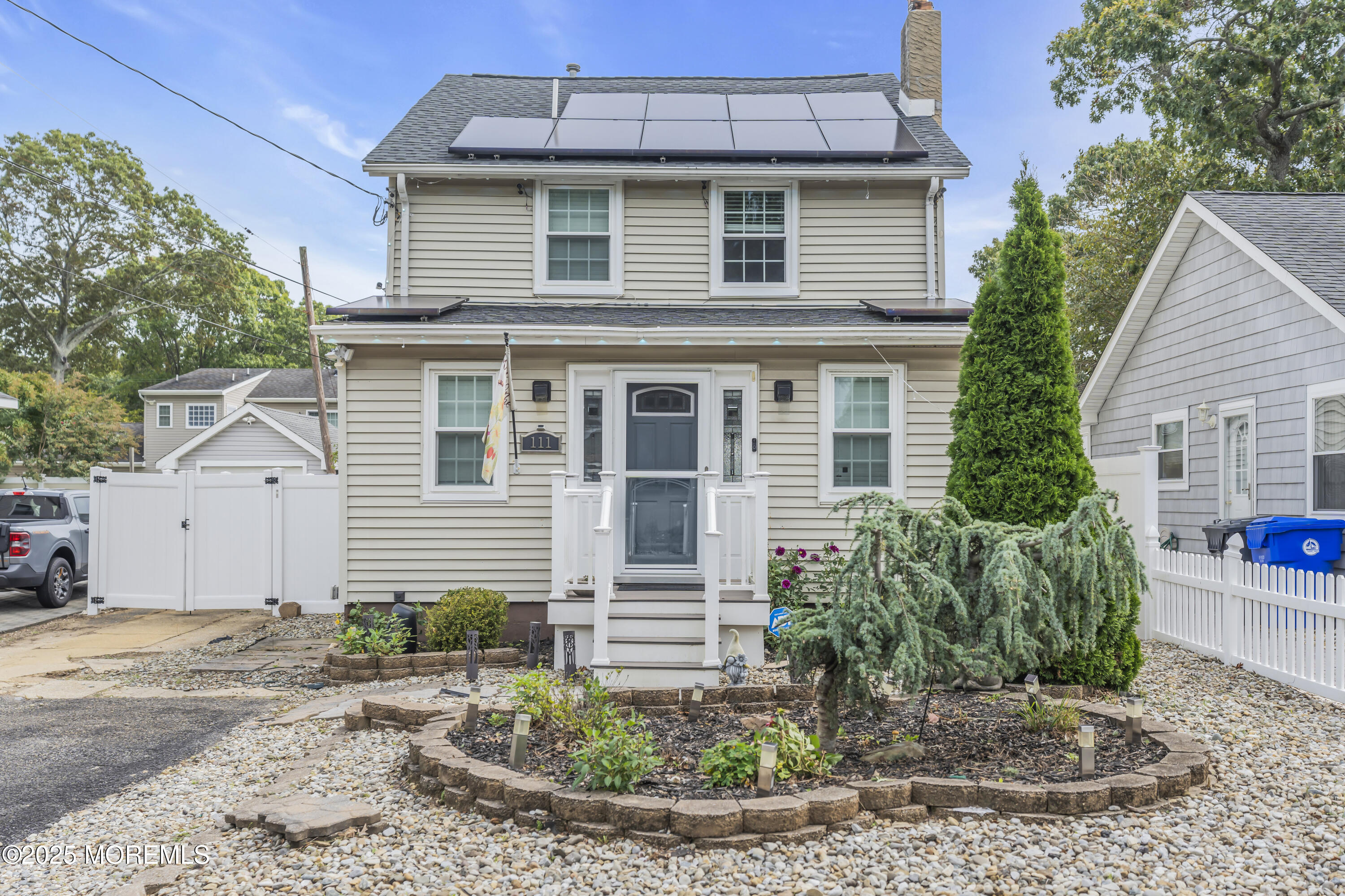 111 Breton Road Brick, NJ 08723 - Photo 1 of 59 a front view of a house with garden