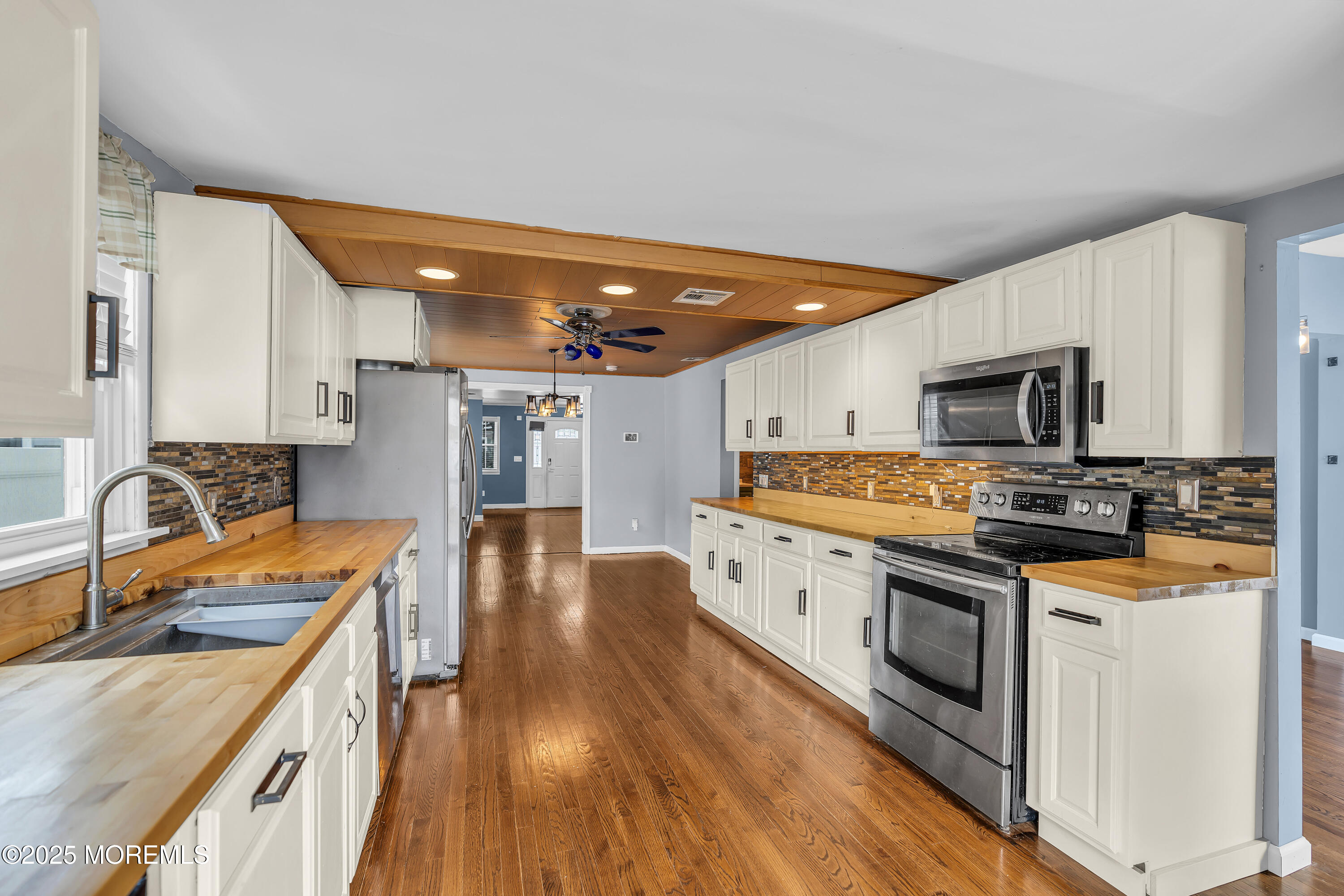 111 Breton Road Brick, NJ 08723 - Photo 12 of 59 a large kitchen with stainless steel appliances granite countertop a stove and a sink