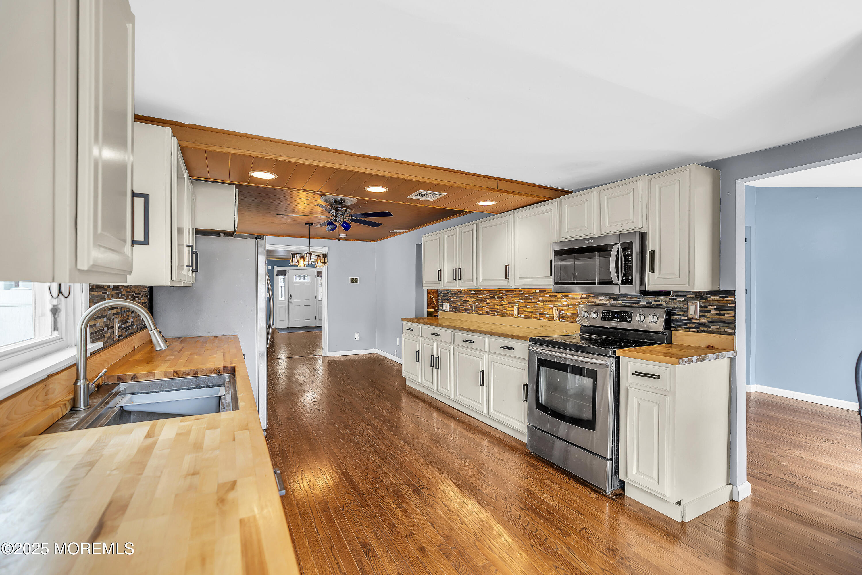 111 Breton Road Brick, NJ 08723 - Photo 13 of 59 a kitchen with stainless steel appliances kitchen island granite countertop a stove and a sink