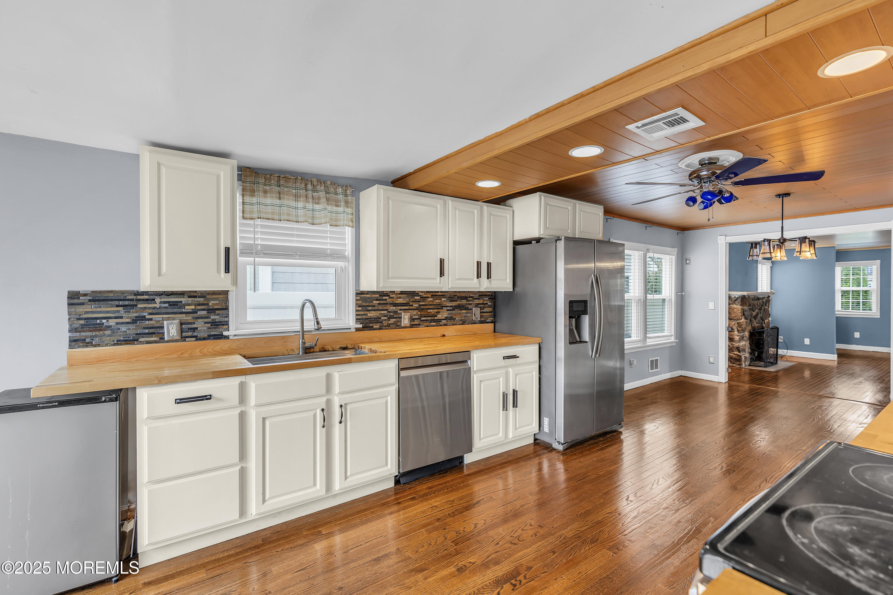 111 Breton Road Brick, NJ 08723 - Photo 15 of 59 a kitchen with stainless steel appliances granite countertop a sink refrigerator and cabinets
