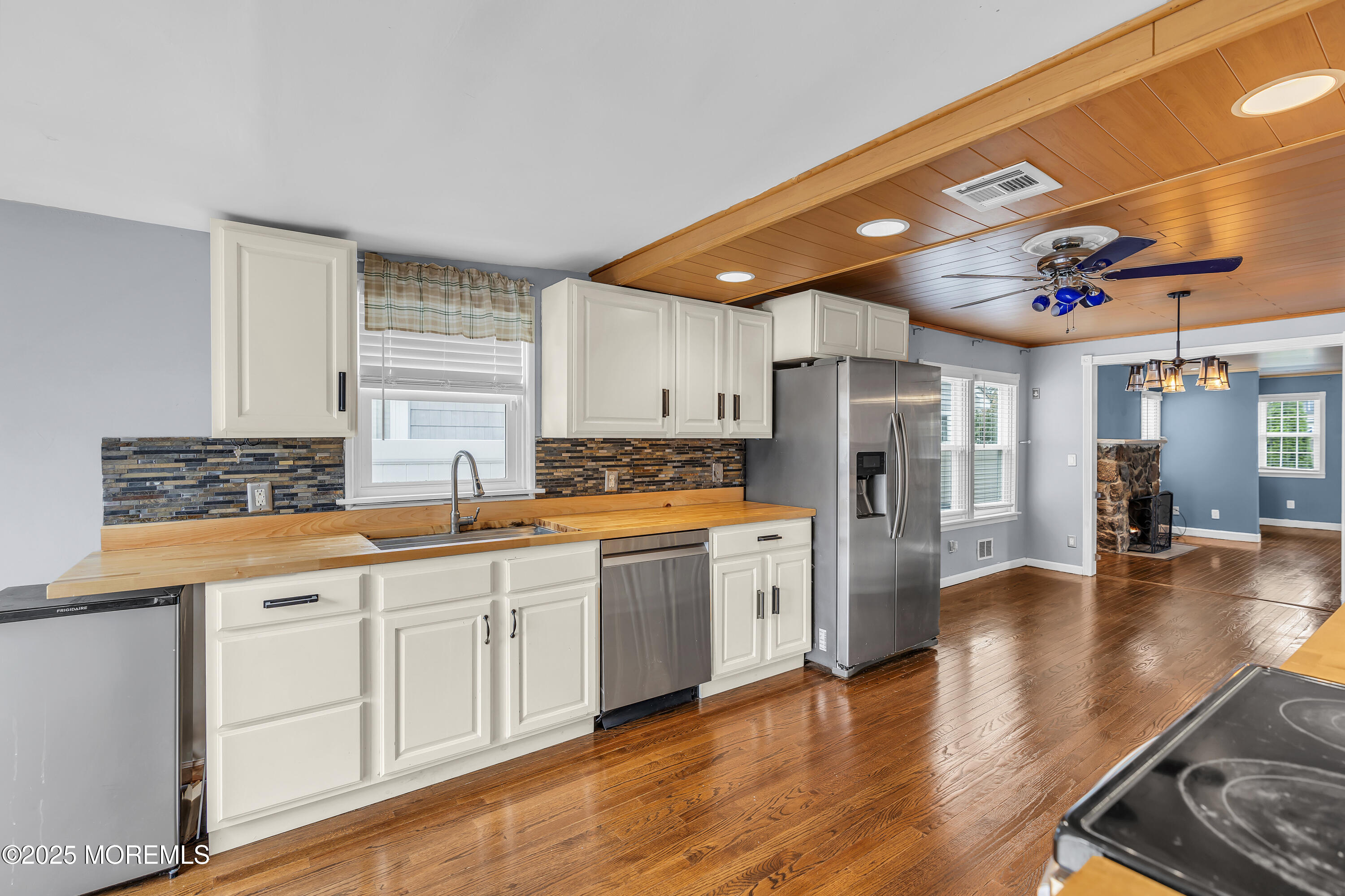 111 Breton Road Brick, NJ 08723 - Photo 16 of 59 a kitchen with stainless steel appliances granite countertop a sink refrigerator and cabinets