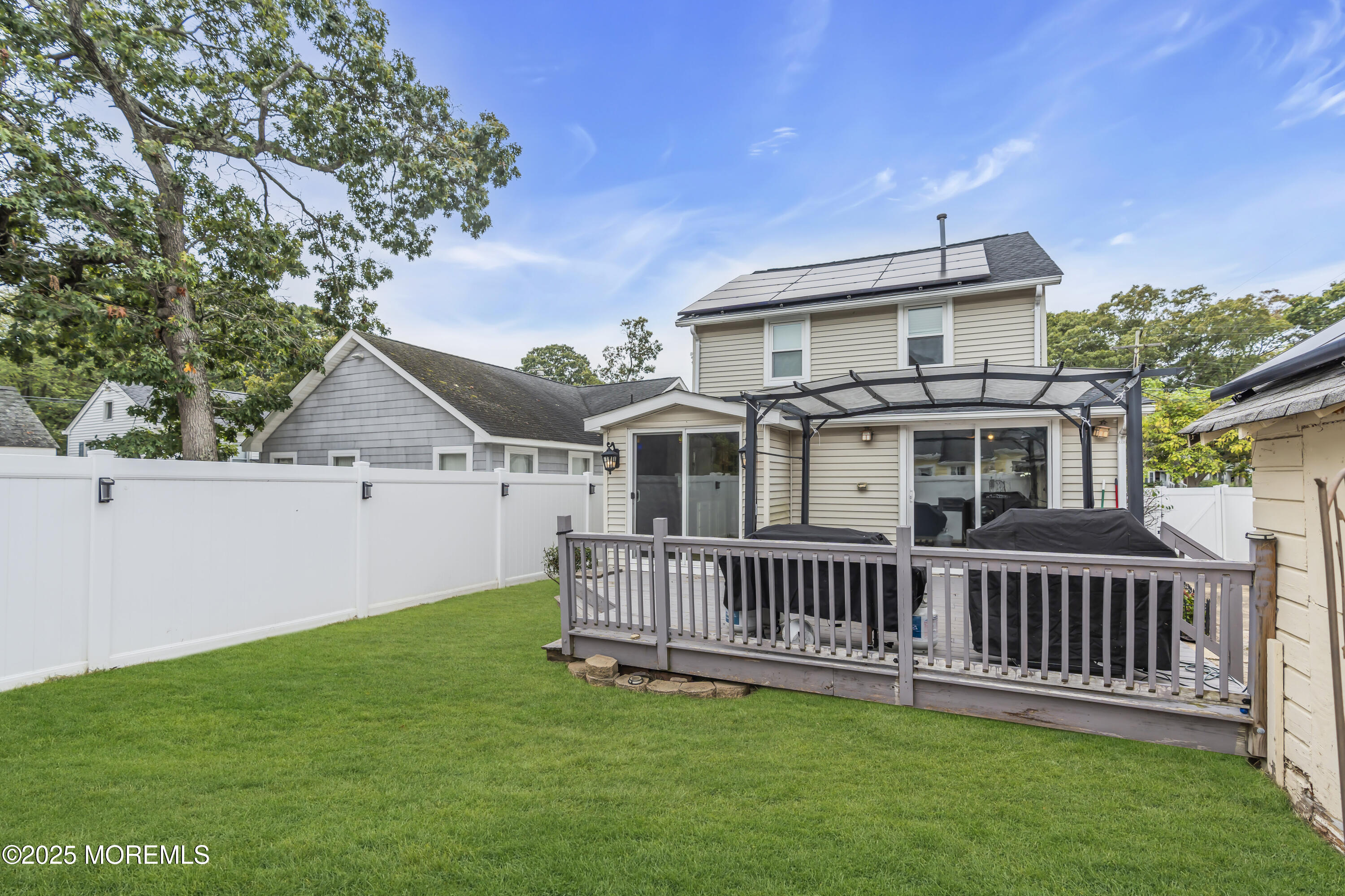 111 Breton Road Brick, NJ 08723 - Photo 28 of 59 a view of a house with a yard and deck
