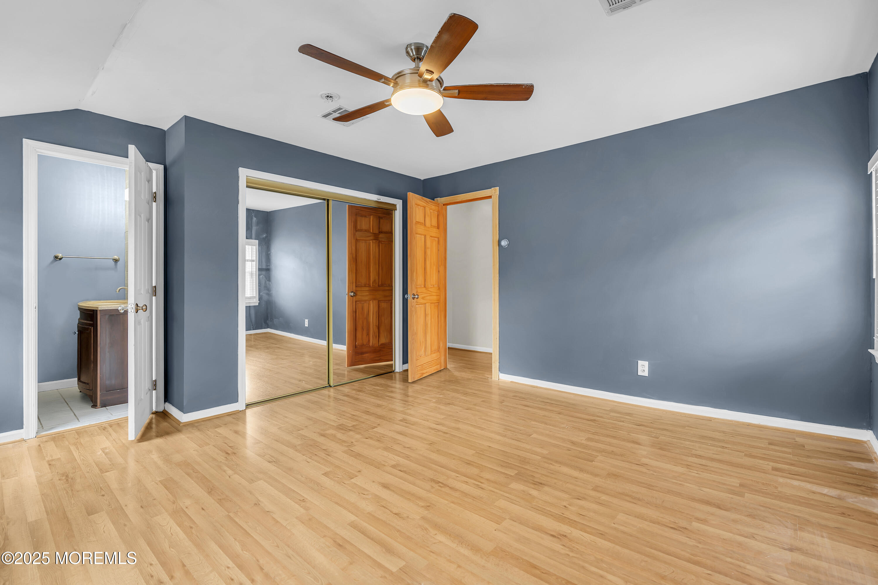 111 Breton Road Brick, NJ 08723 - Photo 41 of 59 a view of empty room with wooden floor and fan