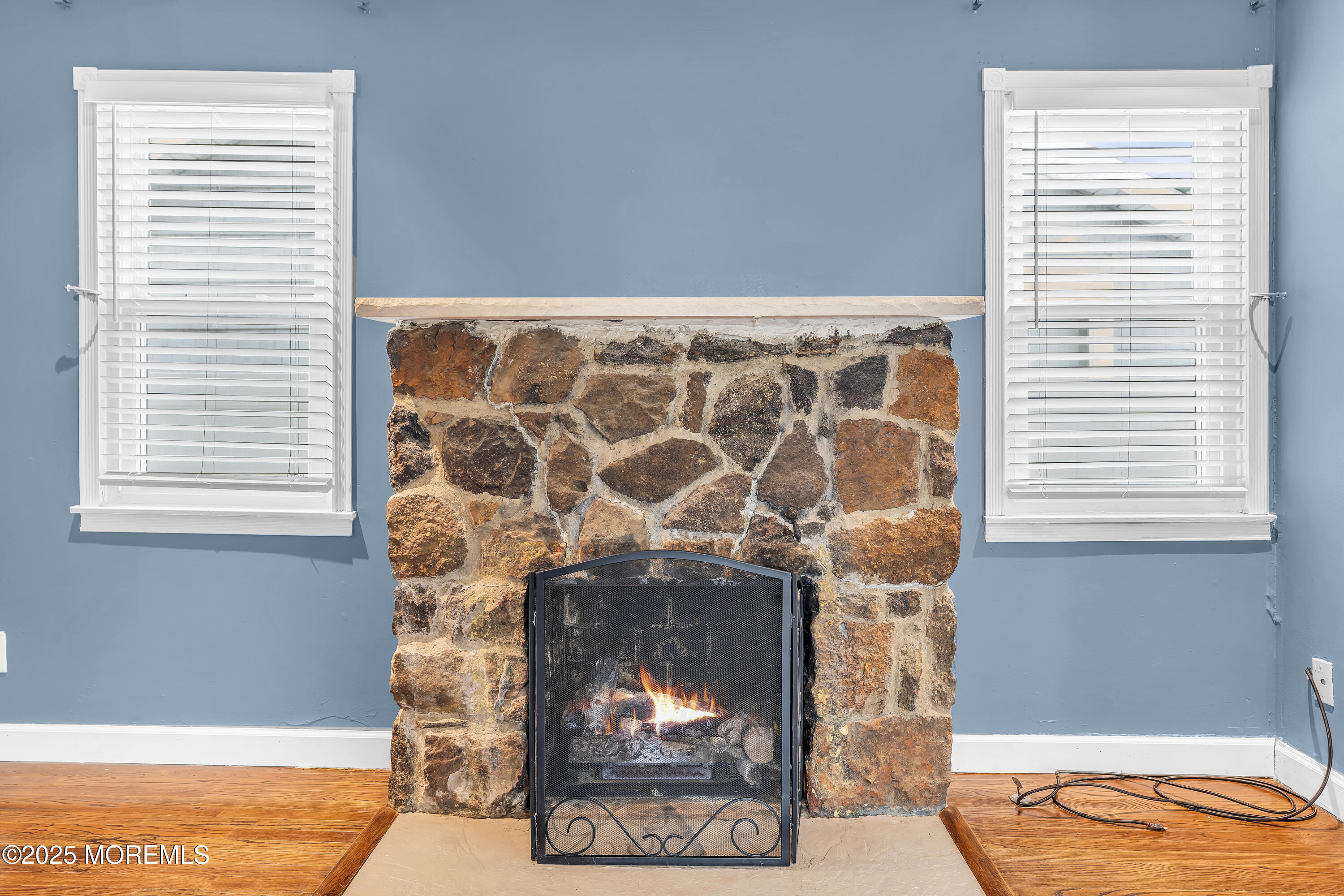 111 Breton Road Brick, NJ 08723 - Photo 47 of 59 a room with a fireplace and a window