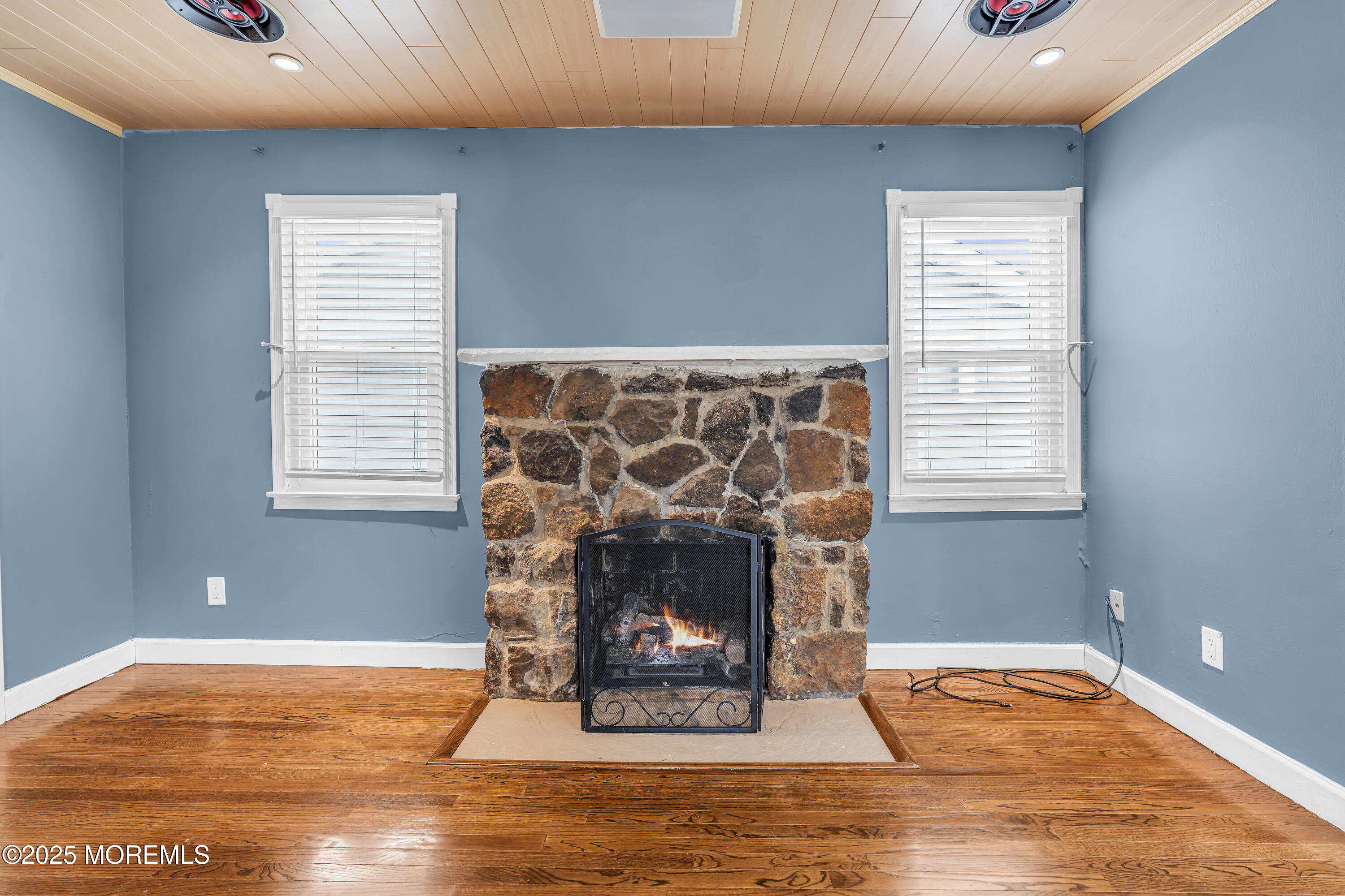 111 Breton Road Brick, NJ 08723 - Photo 5 of 59 a room with a fireplace and wooden floor