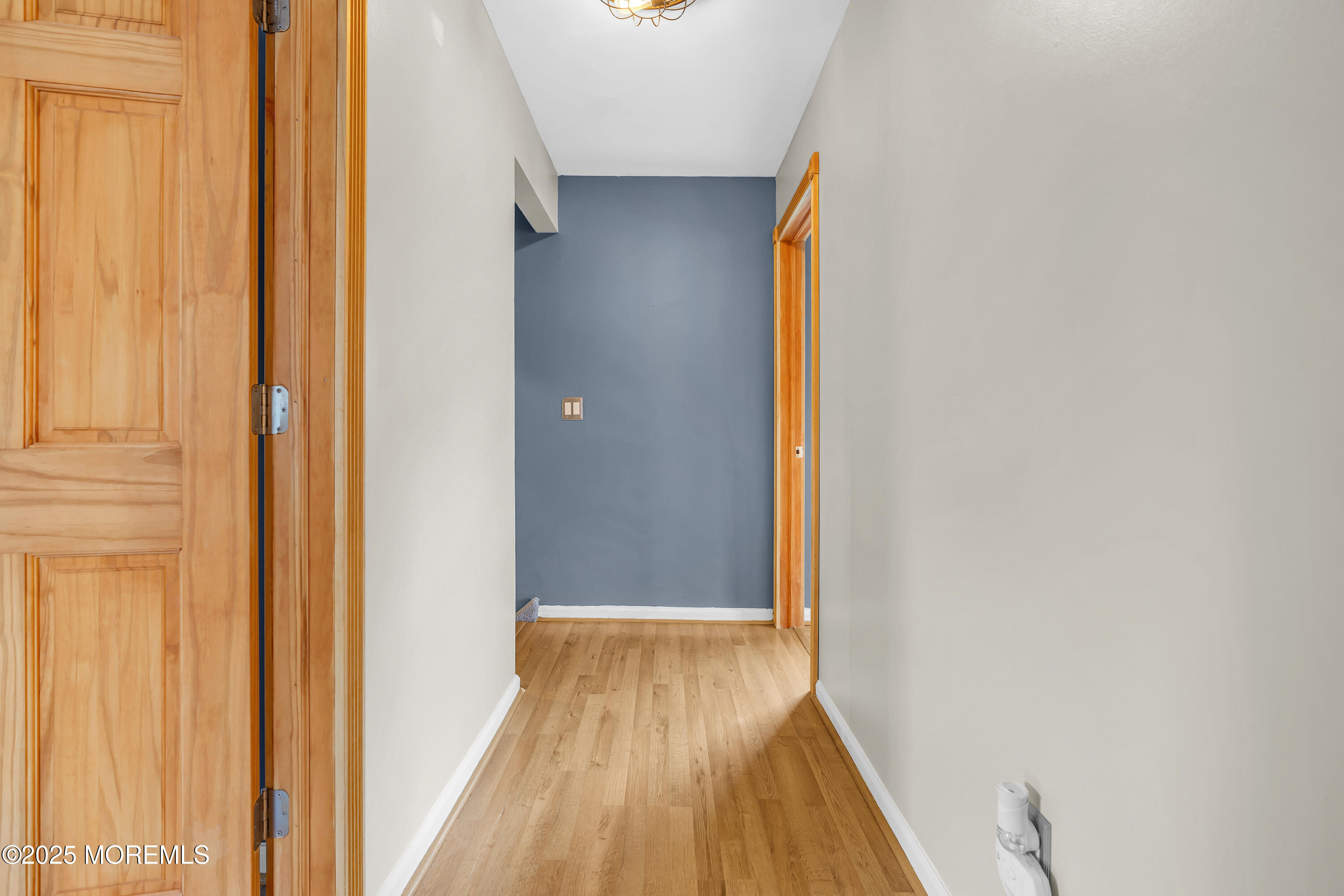 111 Breton Road Brick, NJ 08723 - Photo 51 of 59 a view of a hallway with wooden floor and a bathroom