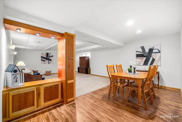 a view of a dining room with furniture and wooden floor