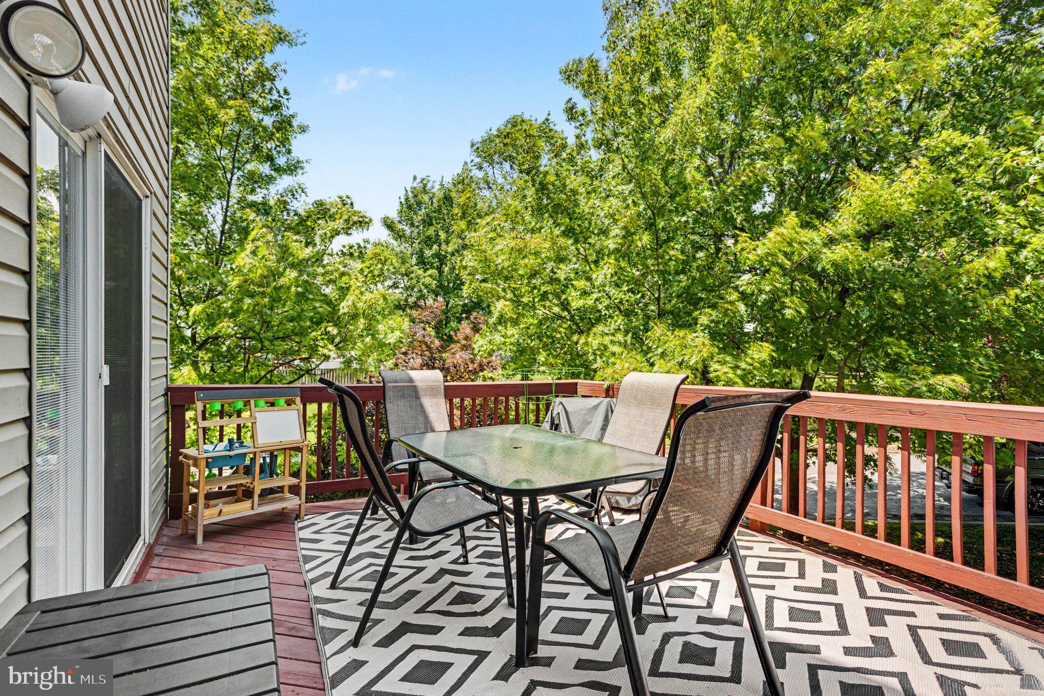 6513 Ridgeborne Drive Baltimore, MD 21237 - Photo 32 of 38 Serene deck surrounded by greenery.