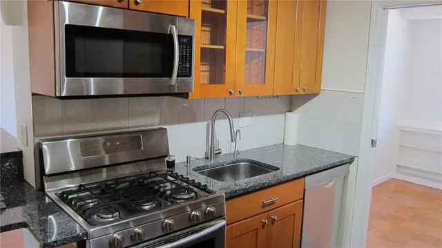 a kitchen with a stove and a microwave