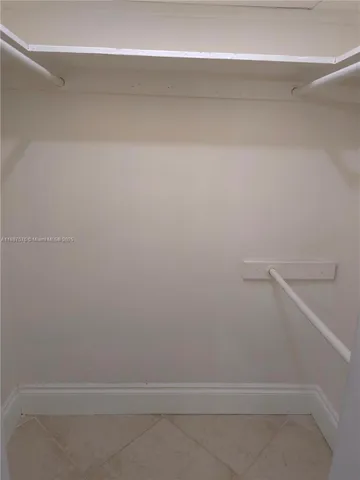 a view of an empty walk in closet