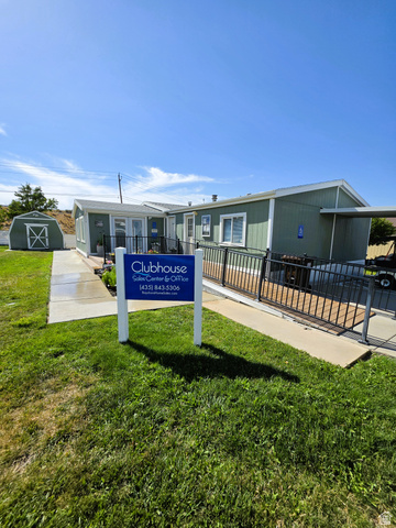 1604 180 East Tooele, UT 84074 - Photo 16 of 16 Single-story building with light green siding and white trim