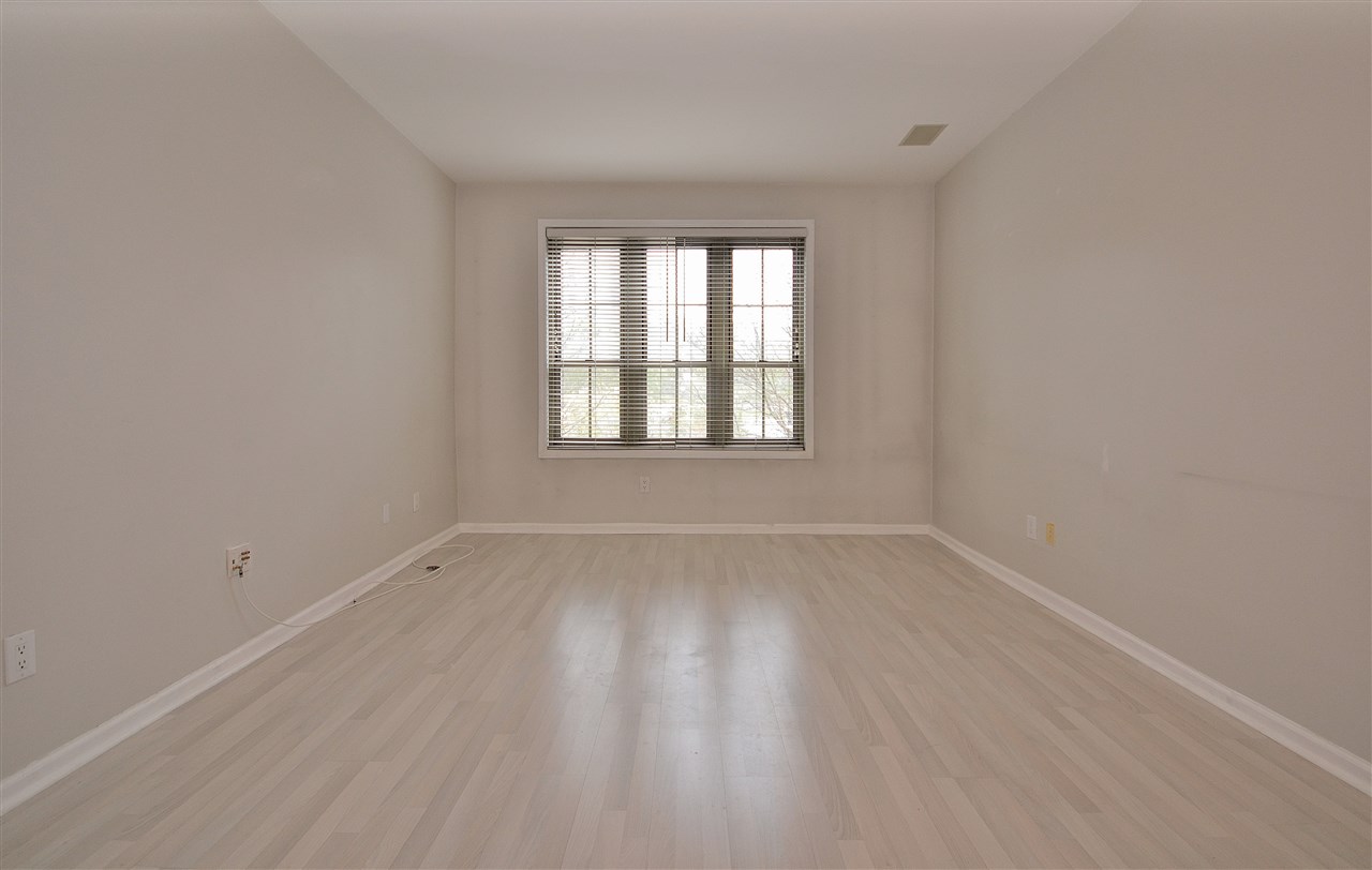 wooden floor and window in an empty room