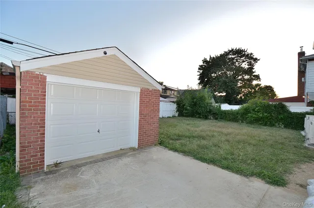 a backyard of a house with plants and trees