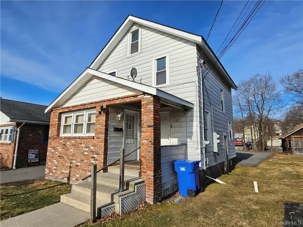 a view of a house with iron stairs