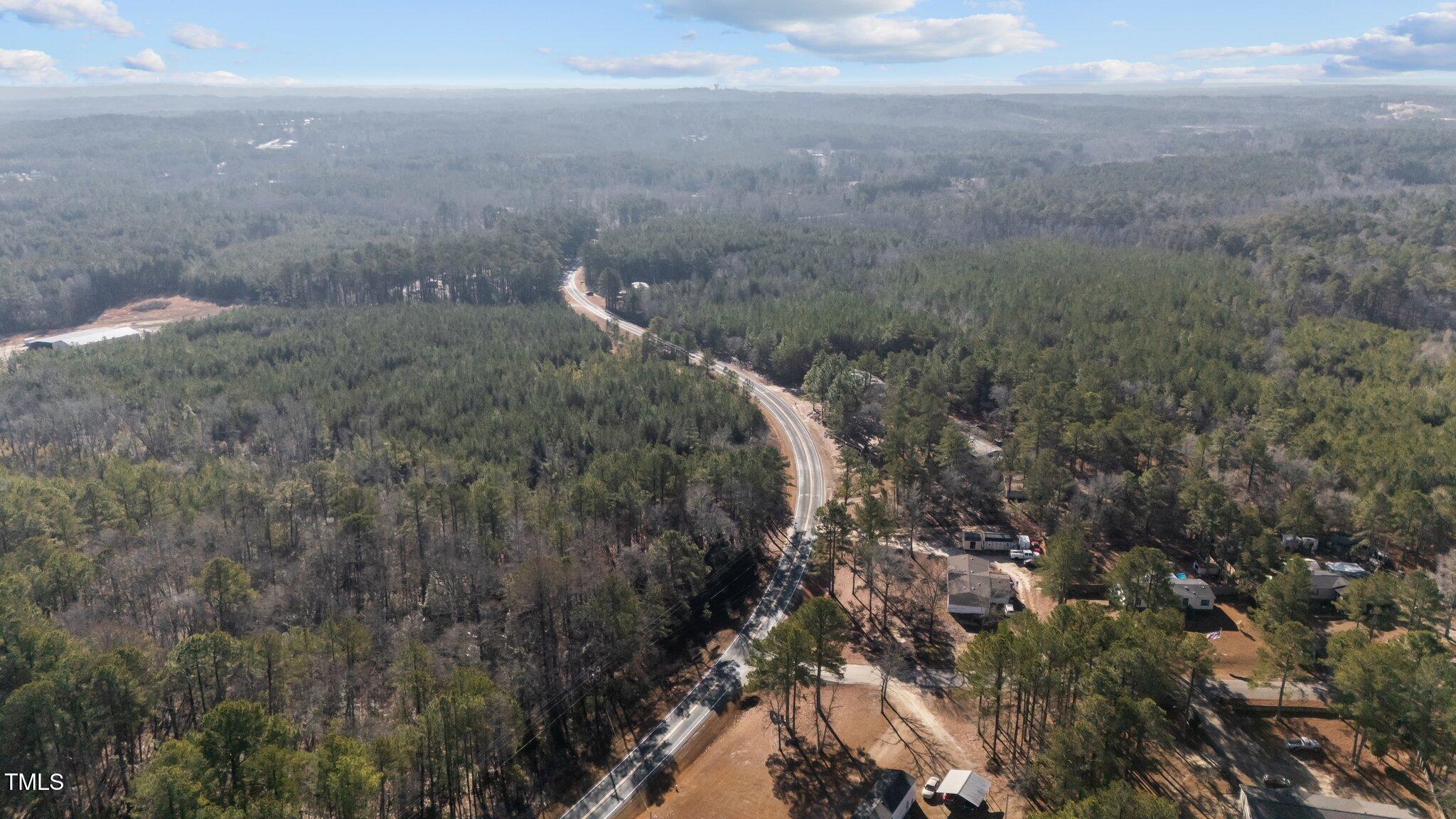 2630 Ponderosa Road Cameron, NC 28326 - Photo 16 of 26 a view of a field of grass and trees
