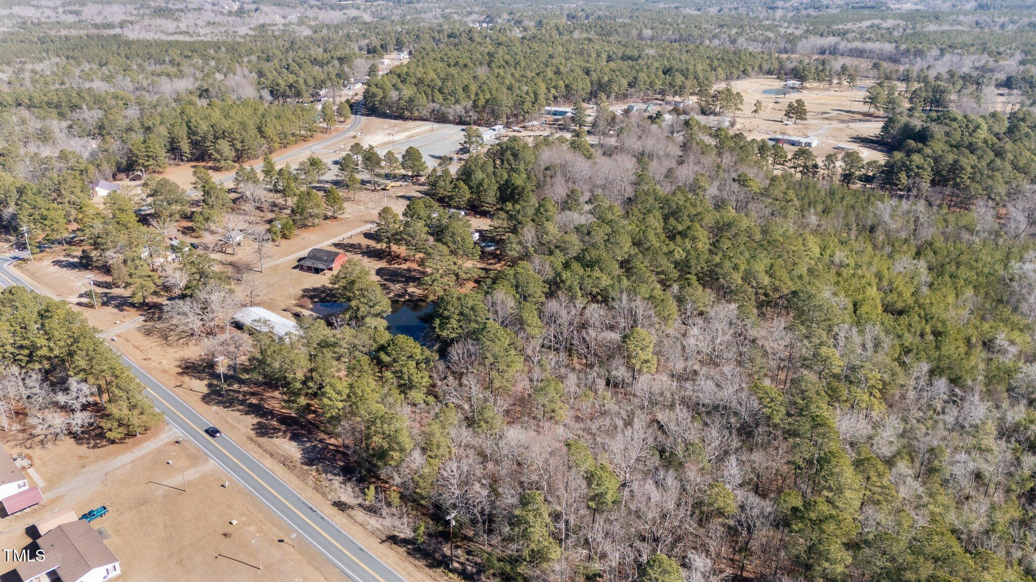 2630 Ponderosa Road Cameron, NC 28326 - Photo 2 of 26 a view of a forest with a tree