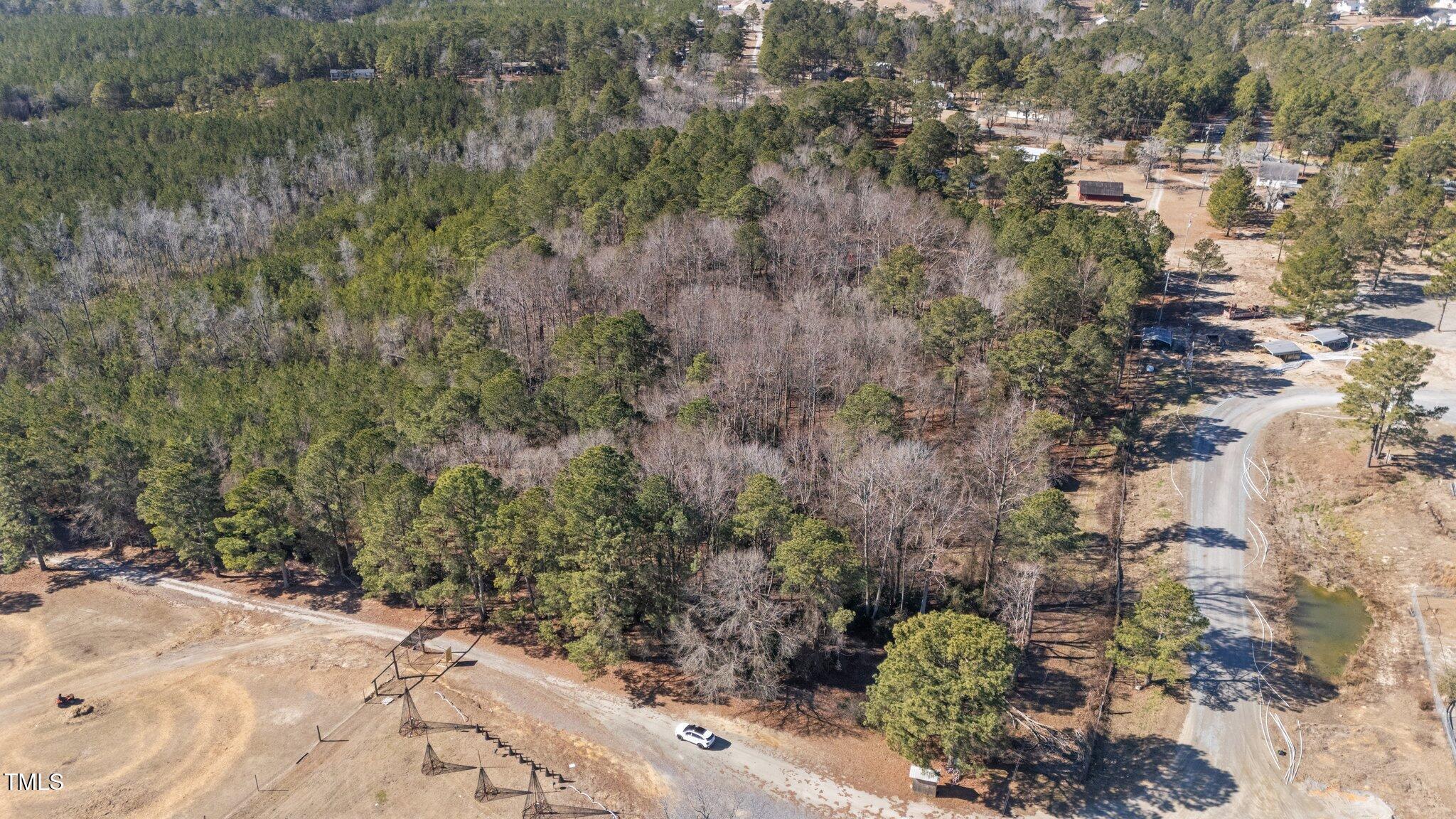 2630 Ponderosa Road Cameron, NC 28326 - Photo 21 of 26 a view of a forest with a yard