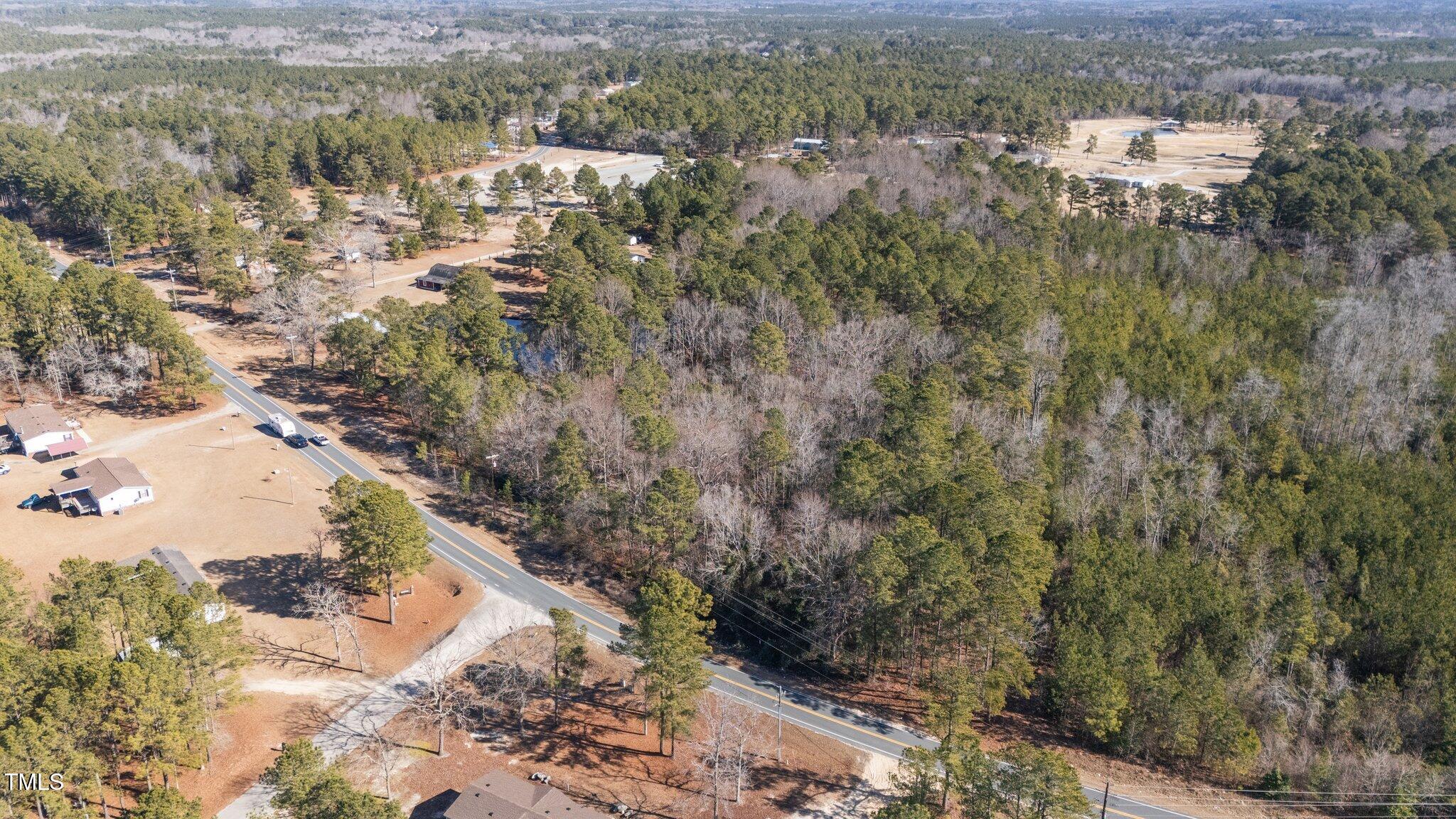2630 Ponderosa Road Cameron, NC 28326 - Photo 24 of 26 a view of a forest with a yard