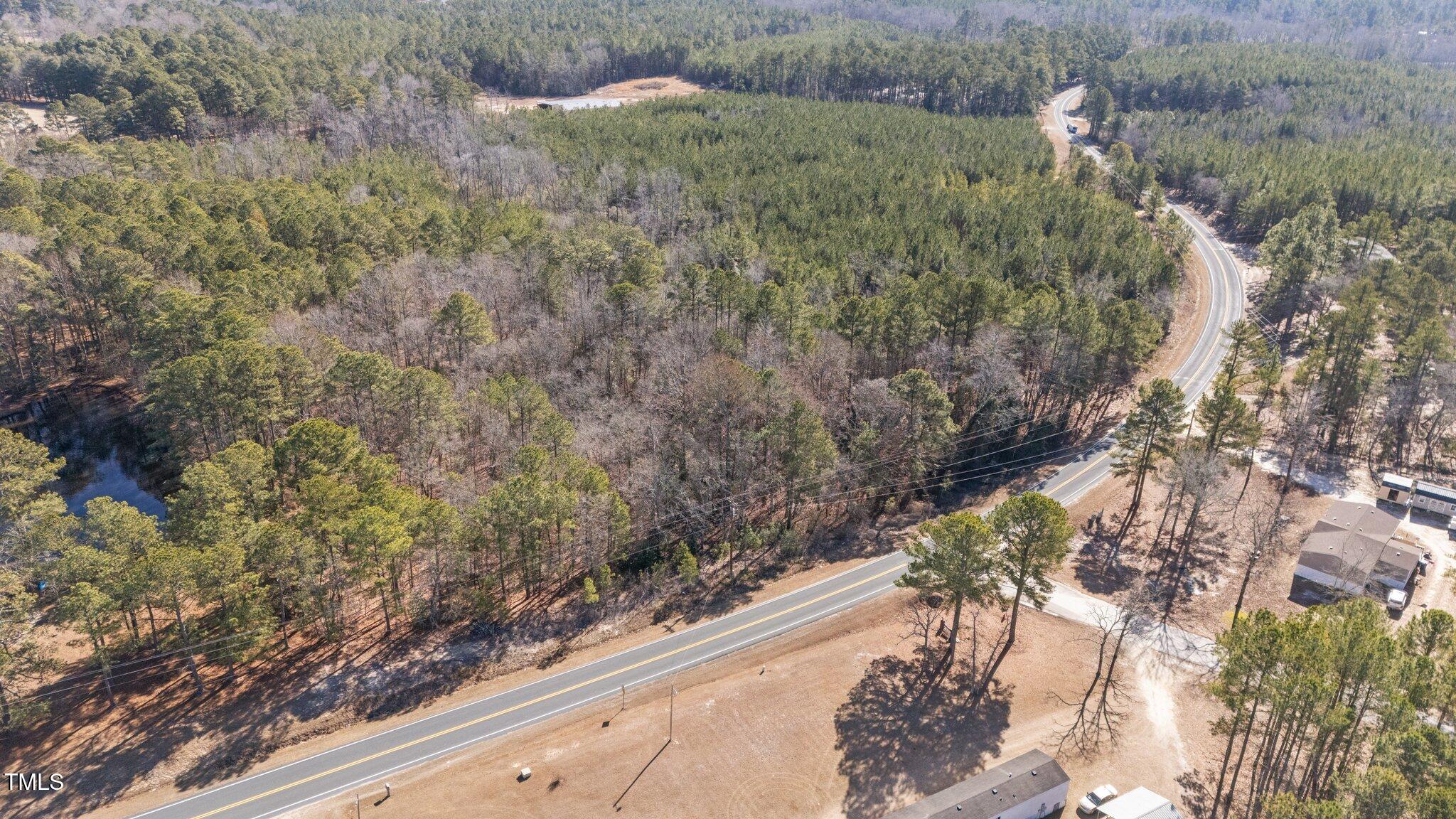 2630 Ponderosa Road Cameron, NC 28326 - Photo 25 of 26 a view of a yard with plants and a bench