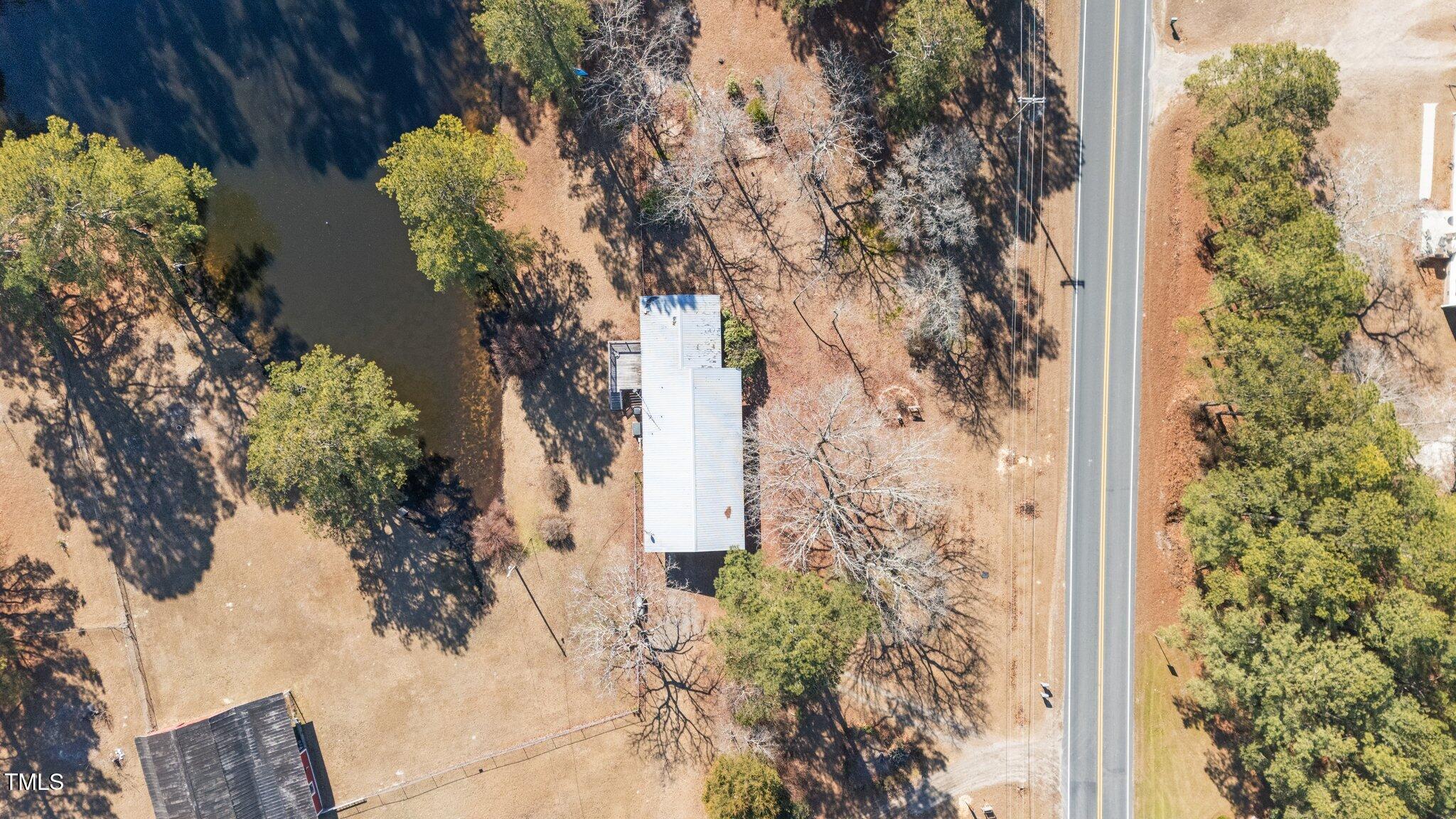 2630 Ponderosa Road Cameron, NC 28326 - Photo 4 of 26 a view of a tree with flower in front of a house