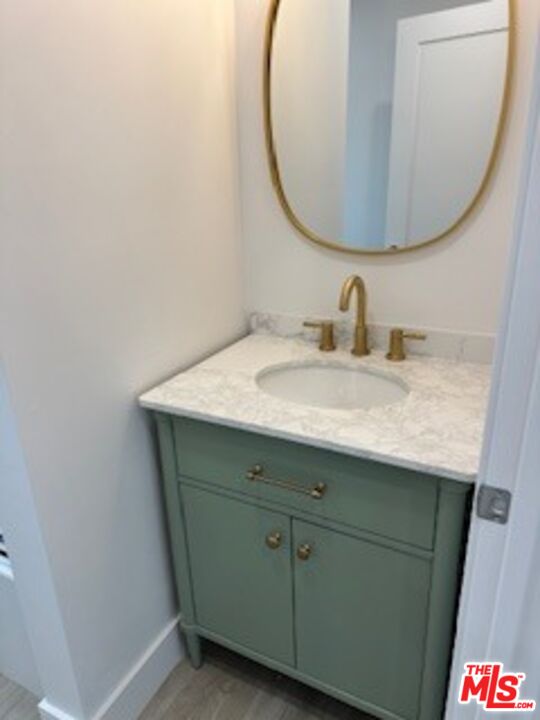 620 25th Street Manhattan Beach, CA 90266 - Photo 11 of 51 a bathroom with a sink and a mirror