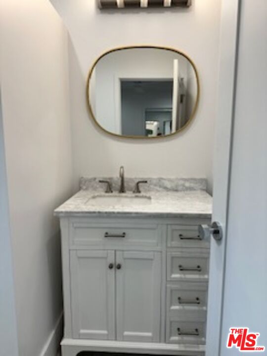 620 25th Street Manhattan Beach, CA 90266 - Photo 18 of 51 a bathroom with a sink and a mirror