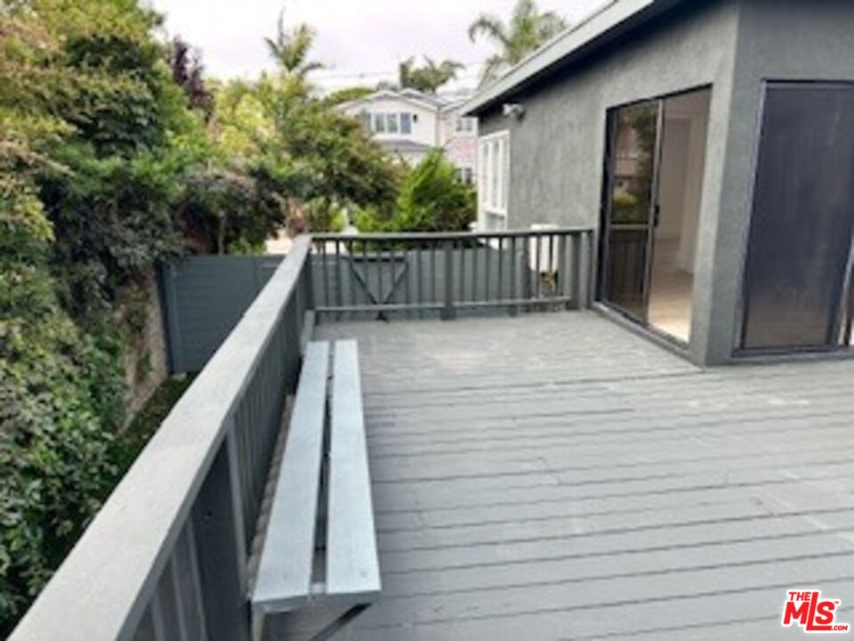 620 25th Street Manhattan Beach, CA 90266 - Photo 32 of 51 a view of balcony with wooden floor and fence