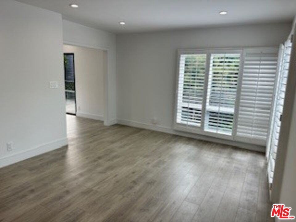 620 25th Street Manhattan Beach, CA 90266 - Photo 4 of 51 a view of an empty room with wooden floor and a window