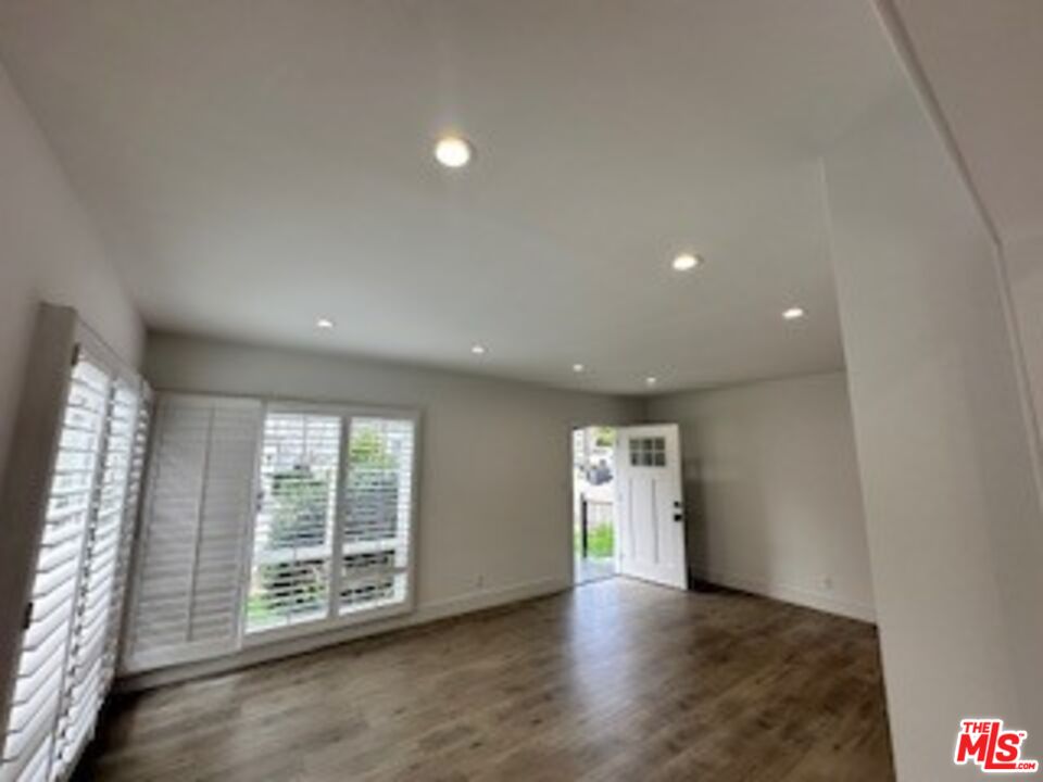 620 25th Street Manhattan Beach, CA 90266 - Photo 41 of 51 an empty room with wooden floor and windows