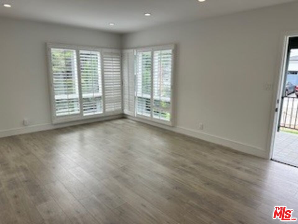 620 25th Street Manhattan Beach, CA 90266 - Photo 5 of 51 an empty room with wooden floor and windows