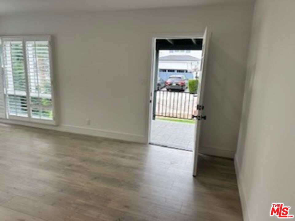620 25th Street Manhattan Beach, CA 90266 - Photo 6 of 51 an empty room with wooden floor and a window