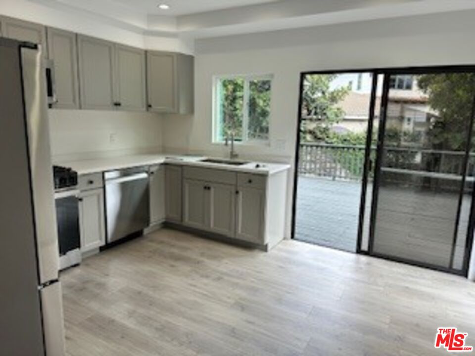 620 25th Street Manhattan Beach, CA 90266 - Photo 8 of 51 a kitchen with stainless steel appliances granite countertop a stove a sink and a refrigerator