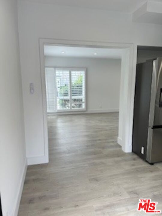 620 25th Street Manhattan Beach, CA 90266 - Photo 10 of 51 a view of an empty room with wooden floor and a window