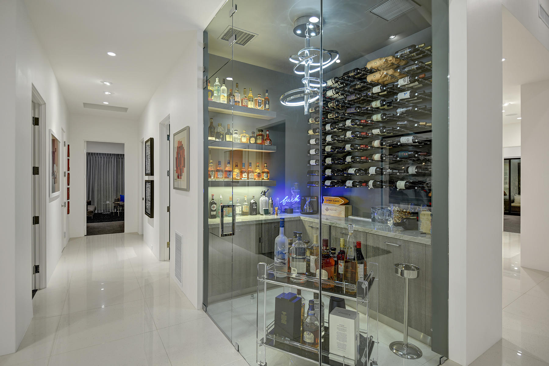 4 Deerfield Court Rancho Mirage, CA 92270 - Photo 12 of 53 a view of a hallway with dining room and chandelier