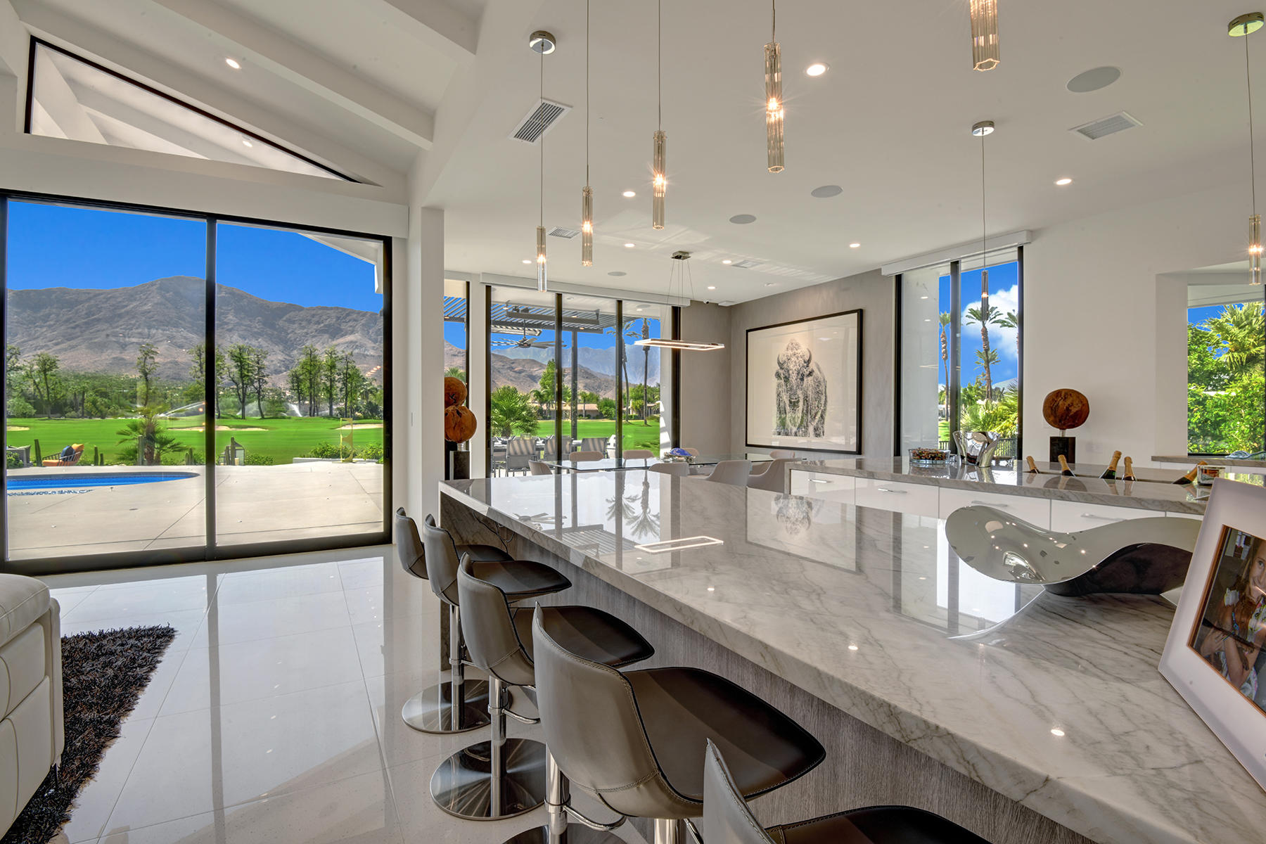 4 Deerfield Court Rancho Mirage, CA 92270 - Photo 16 of 53 a large kitchen with kitchen island granite countertop a large window