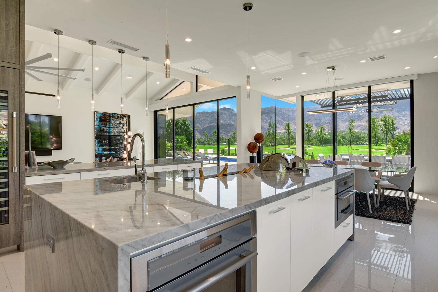 4 Deerfield Court Rancho Mirage, CA 92270 - Photo 17 of 53 a kitchen with stainless steel appliances granite countertop a sink and a large window