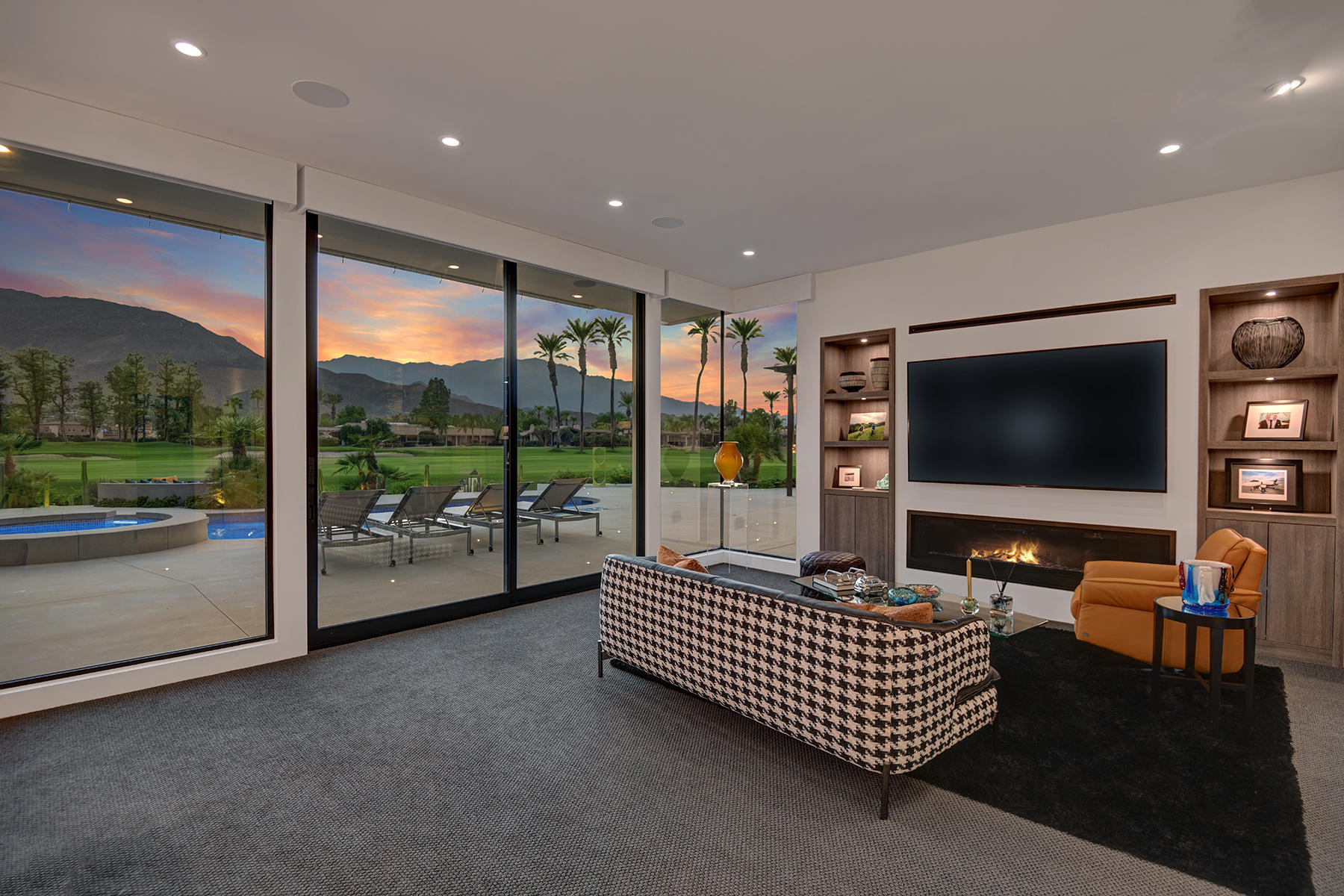 4 Deerfield Court Rancho Mirage, CA 92270 - Photo 26 of 53 a living room with furniture and a flat screen tv