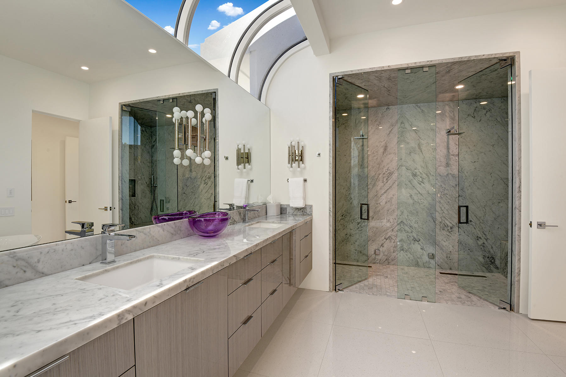 4 Deerfield Court Rancho Mirage, CA 92270 - Photo 30 of 53 a bathroom with a granite countertop sink mirror and shower