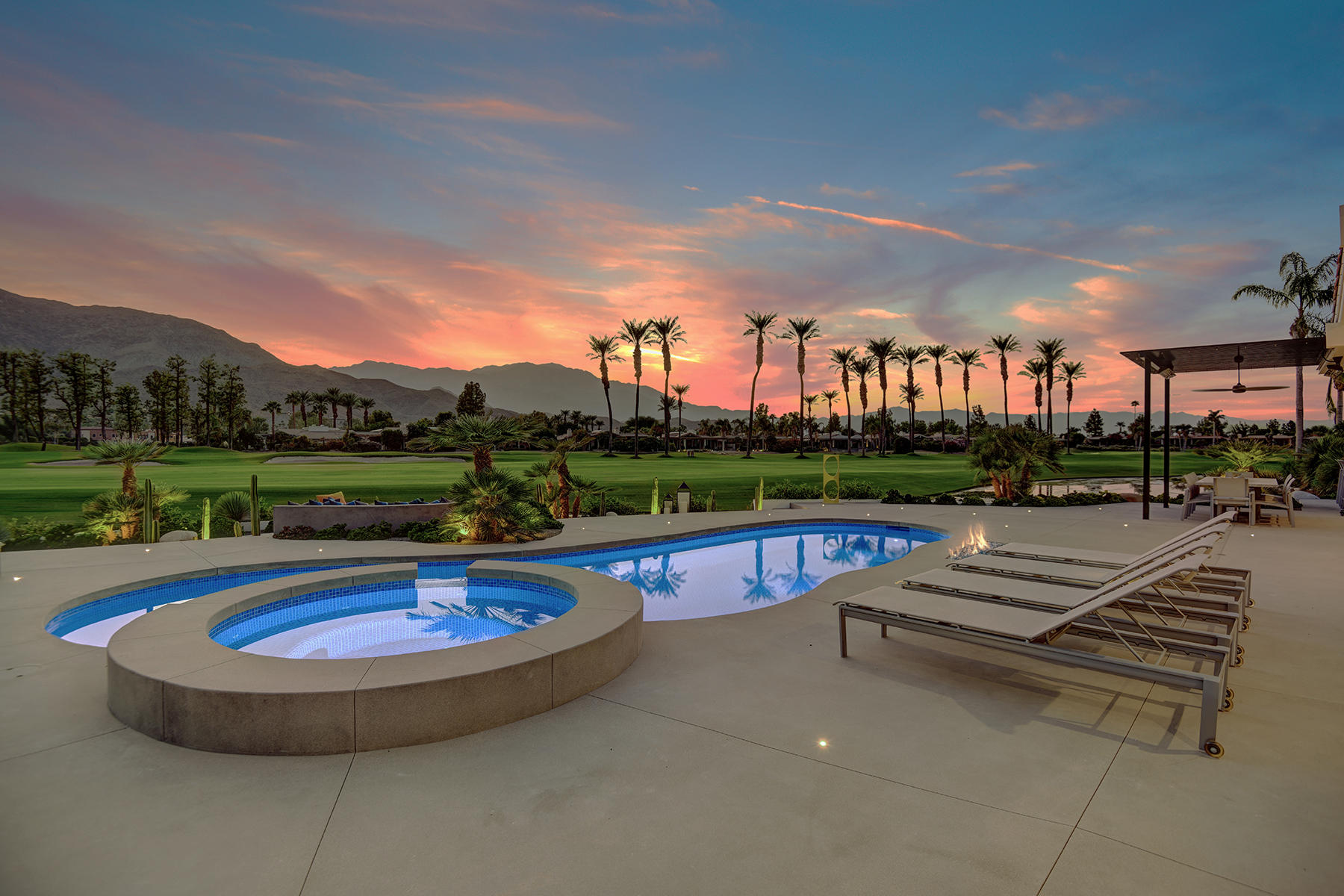 4 Deerfield Court Rancho Mirage, CA 92270 - Photo 4 of 53 a view of a swimming pool and a terrace