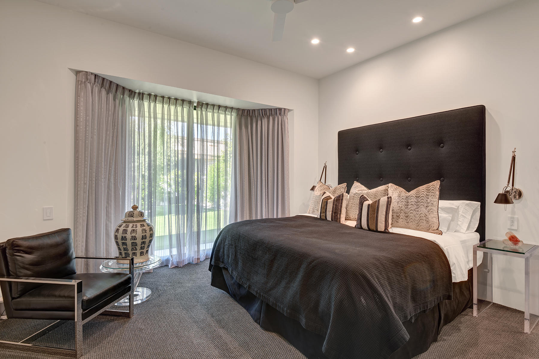 4 Deerfield Court Rancho Mirage, CA 92270 - Photo 32 of 53 a bed room with a bed and a chair