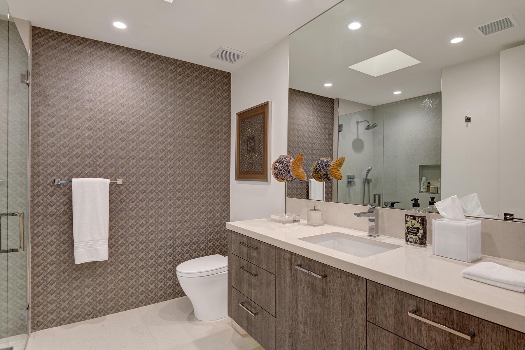 4 Deerfield Court Rancho Mirage, CA 92270 - Photo 35 of 53 a bathroom with a double vanity sink toilet and mirror