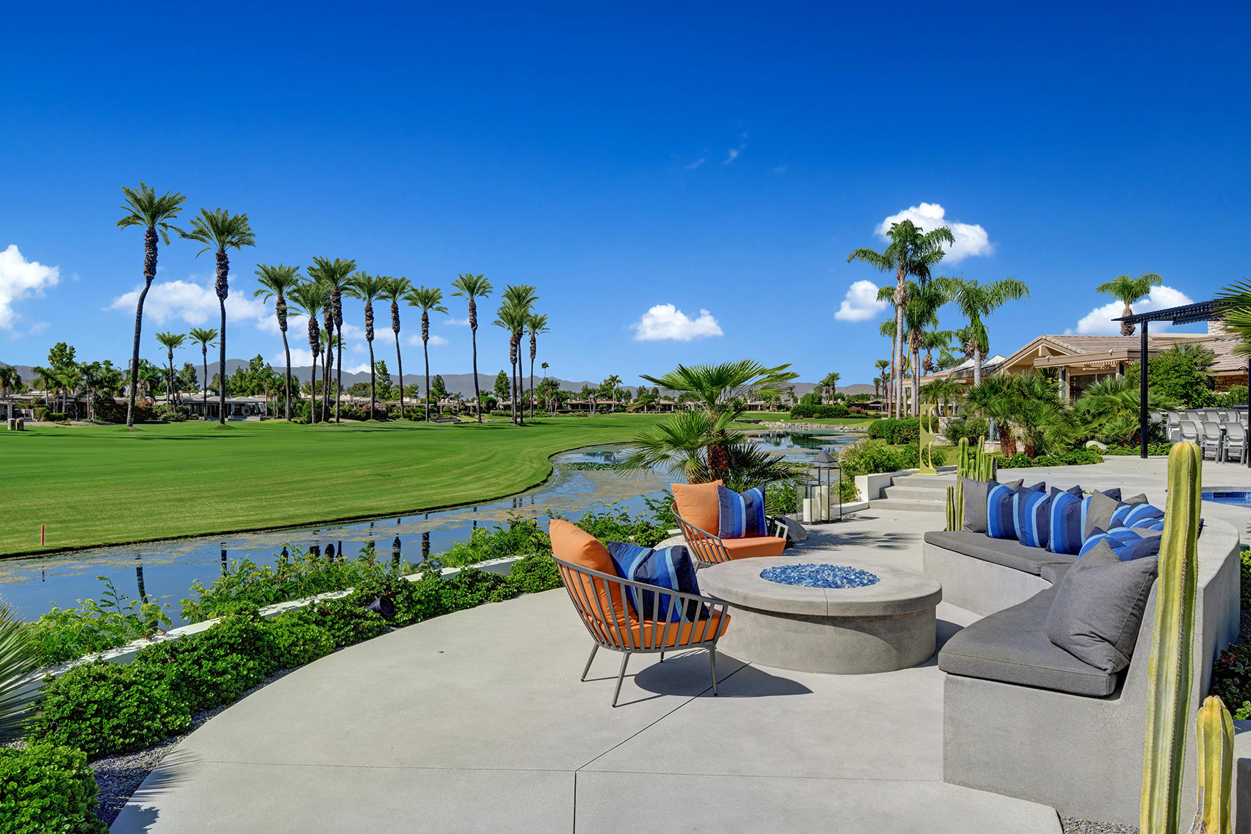 4 Deerfield Court Rancho Mirage, CA 92270 - Photo 40 of 53 a view of a chairs and table in a patio