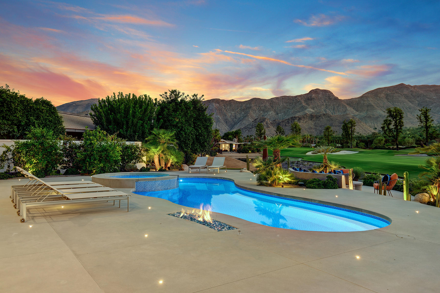 4 Deerfield Court Rancho Mirage, CA 92270 - Photo 41 of 53 a view of a swimming pool with a table and chairs