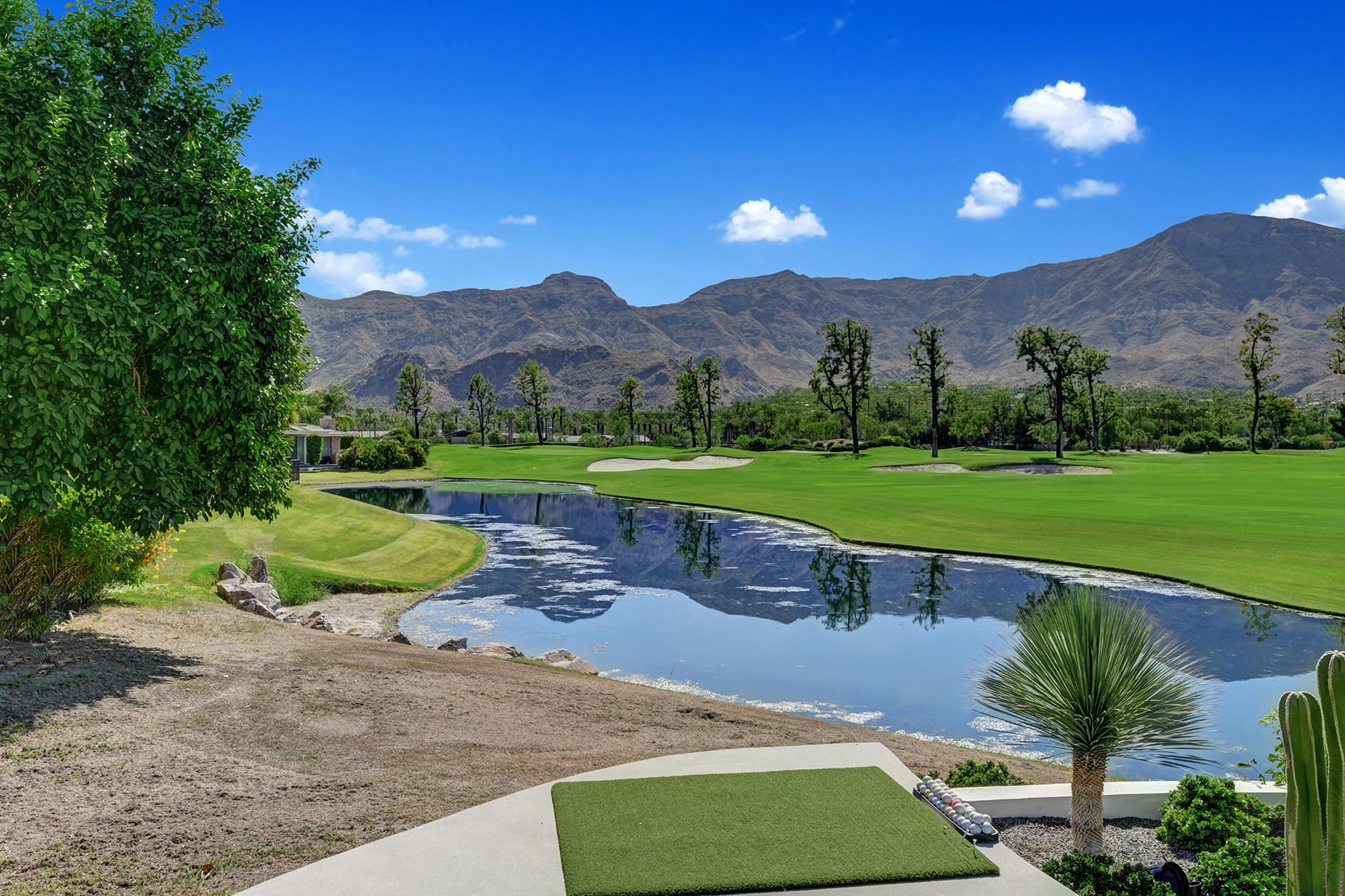 4 Deerfield Court Rancho Mirage, CA 92270 - Photo 42 of 53 a view of outdoor space yard and swimming pool