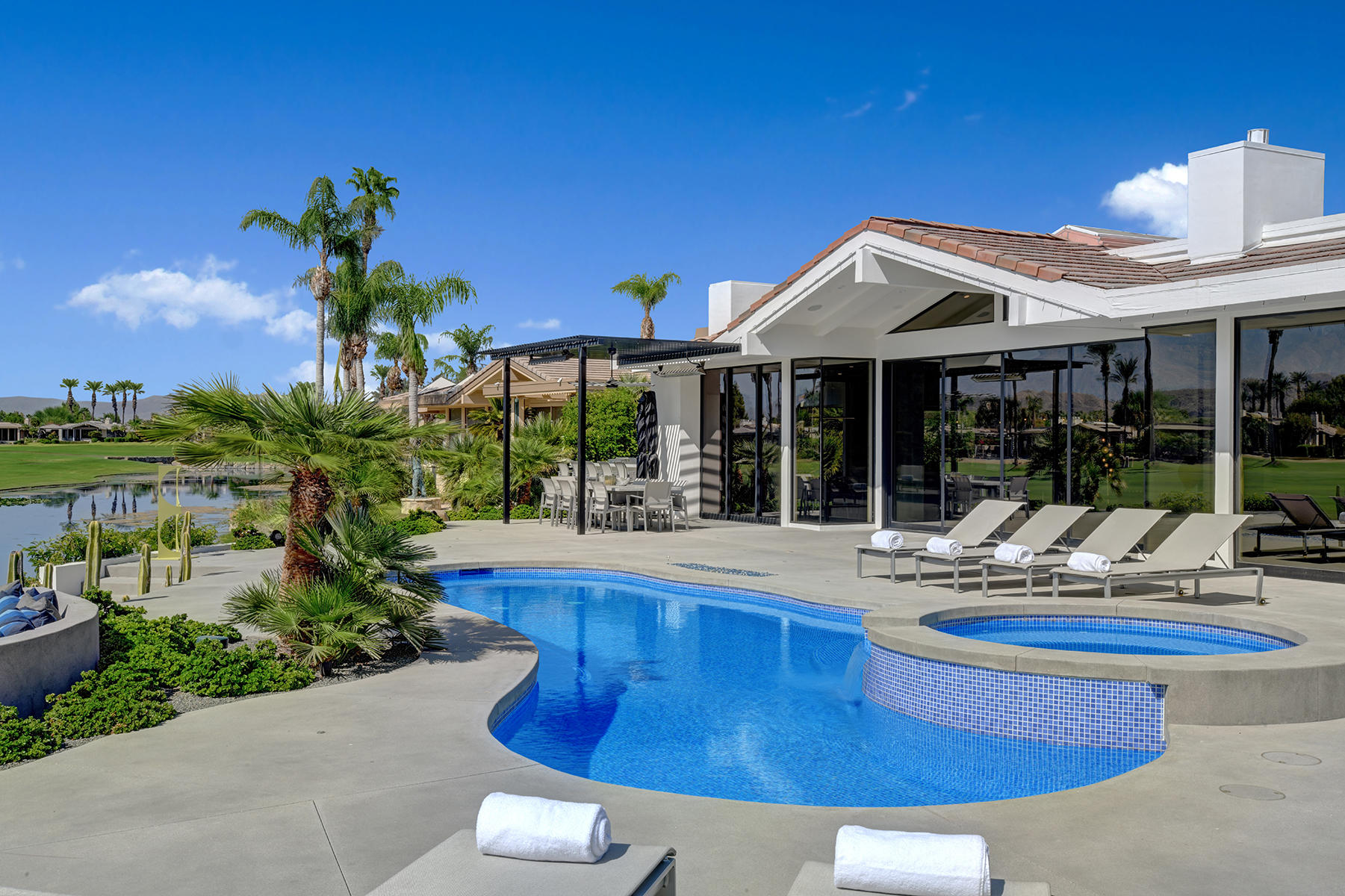 4 Deerfield Court Rancho Mirage, CA 92270 - Photo 45 of 53 a view of a house with swimming pool and sitting area