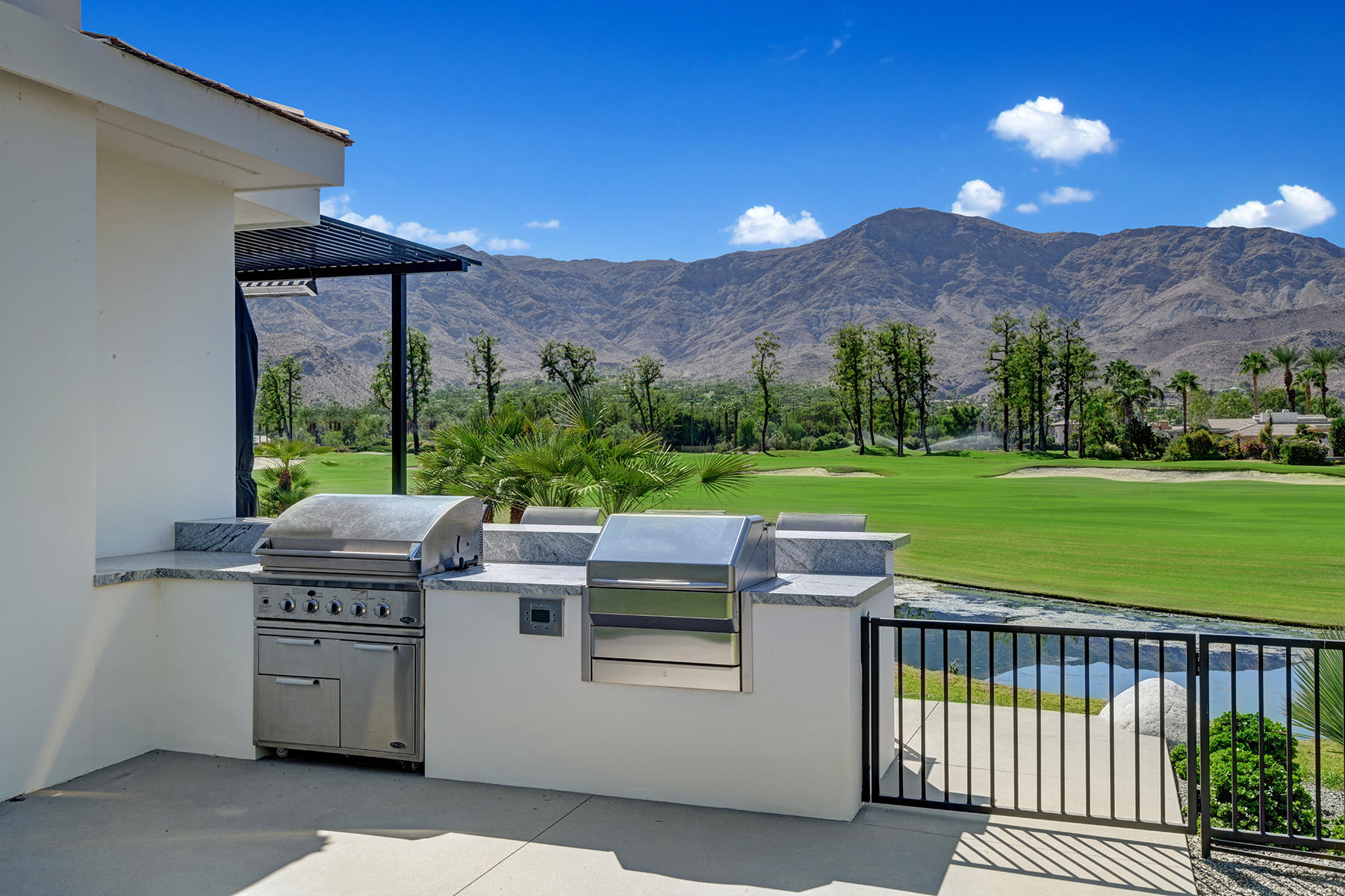 4 Deerfield Court Rancho Mirage, CA 92270 - Photo 49 of 53 a view of a patio with a yard