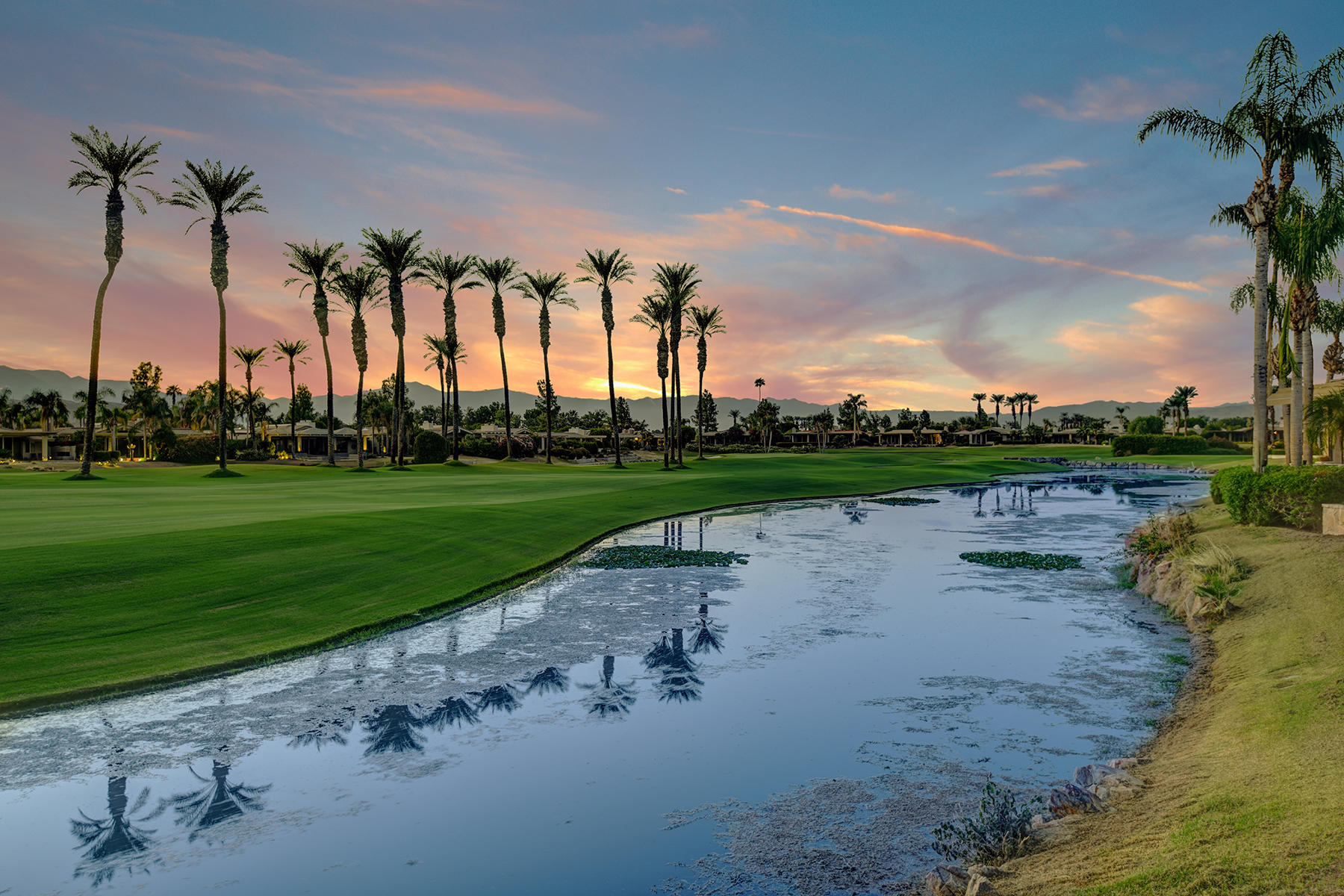 4 Deerfield Court Rancho Mirage, CA 92270 - Photo 50 of 53 a view of a lake with a big yard
